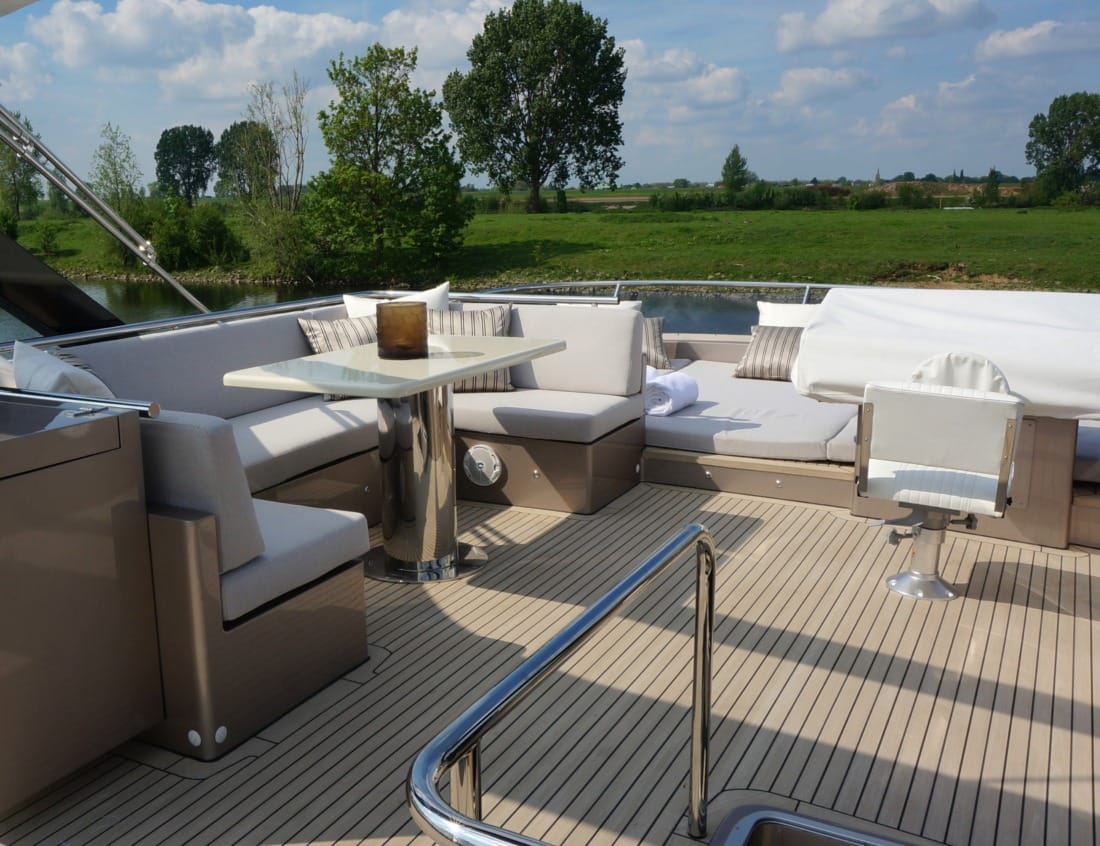 Furniture outside on the back of Phantom 79 (P-Series) Outdoor seating area on the aft deck of a Phantom 79 (P-Series) yacht.