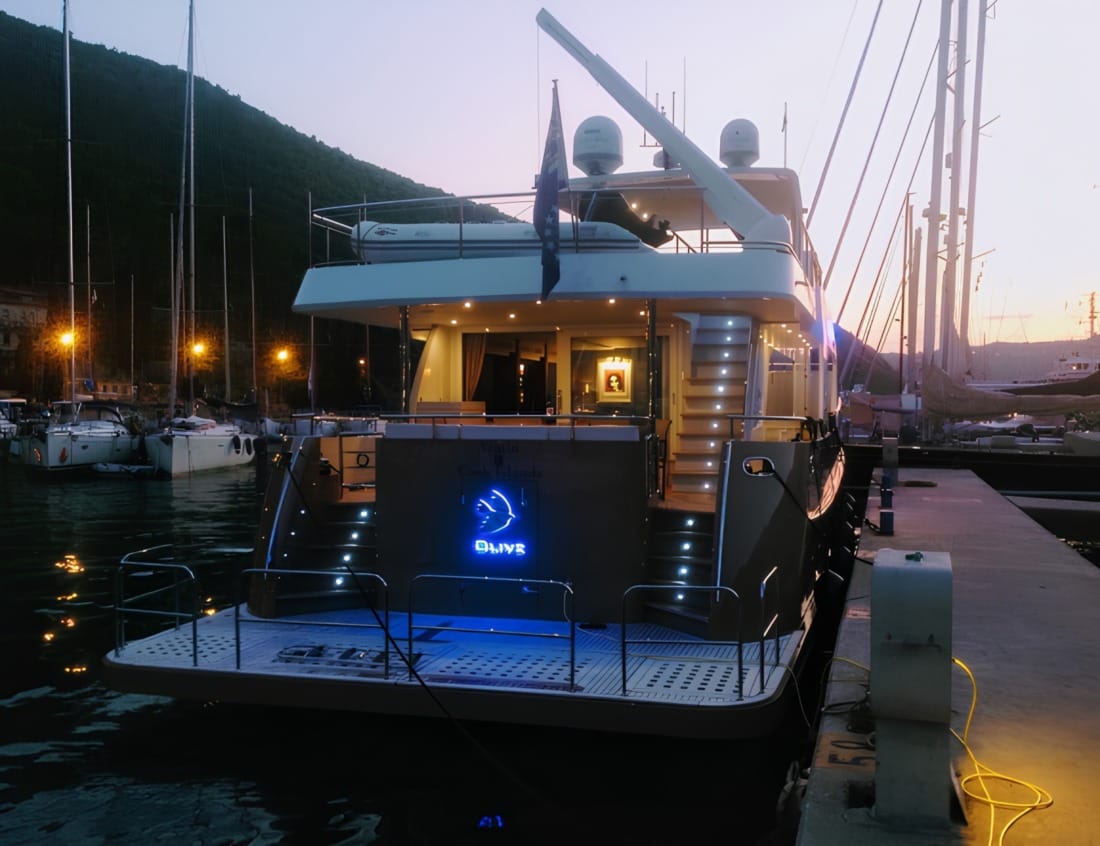 Rear view of a VDHY Explorer 2100 yacht (EX-Series) docked at a marina at dusk.