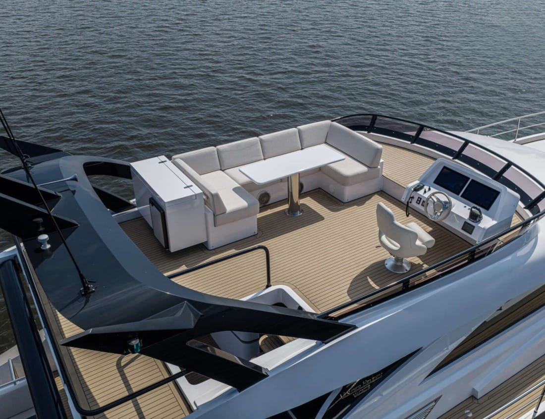 Exclusive Deluxe 2000 Sportbridge - Exclusive Series with seating area and helm station.