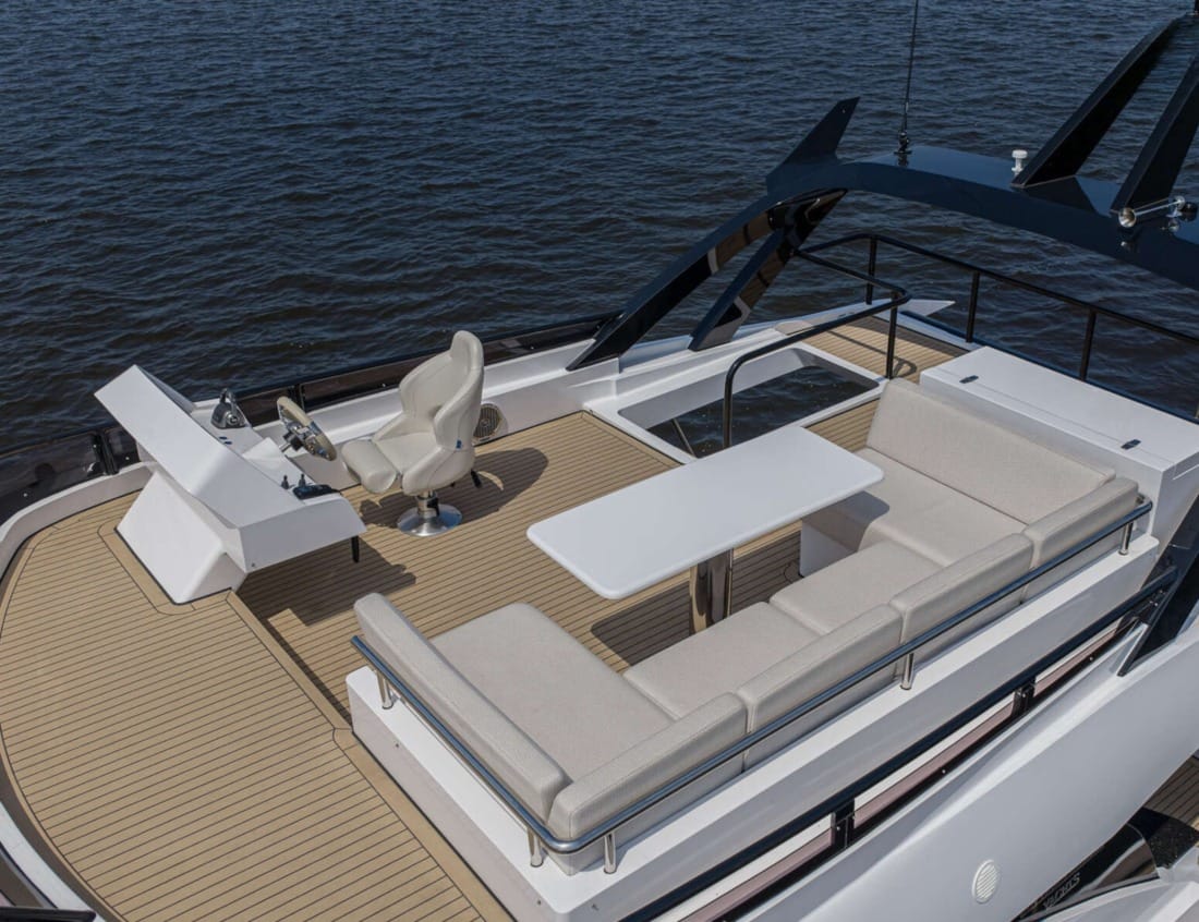Exclusive Deluxe 2000 Sportbridge - Exclusive Series with seating area and helm station.