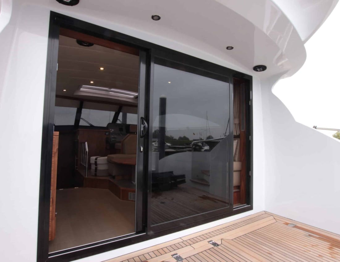 Aft deck entrance of an Exclusive Deluxe 1600 - Exclusive Series with sliding glass doors.