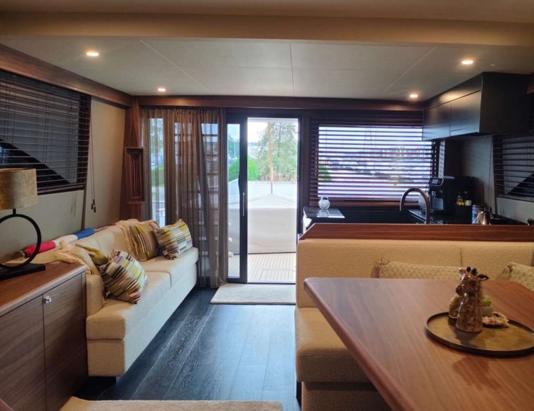 Interior of an Exclusive Deluxe 2000 Sportbridge - Exclusive Series with dining area, lounge and kitchen.