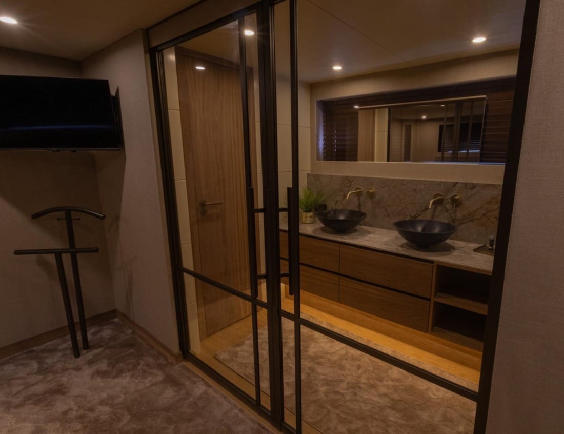 Bathroom of a 2026 Exclusive Deluxe 2000 Sportbridge Interior - Exclusive Series with double sinks.
