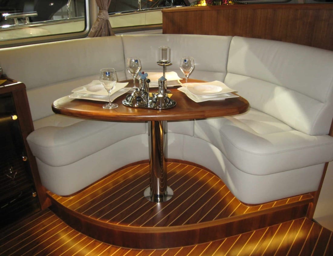 Dining area of a Dynamic Deluxe 1500 - Dynamic Series with table and seating.