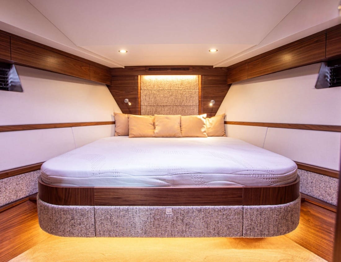 Bedroom of an Exclusive Deluxe 1600 - Exclusive Series with double bed and wood interior.