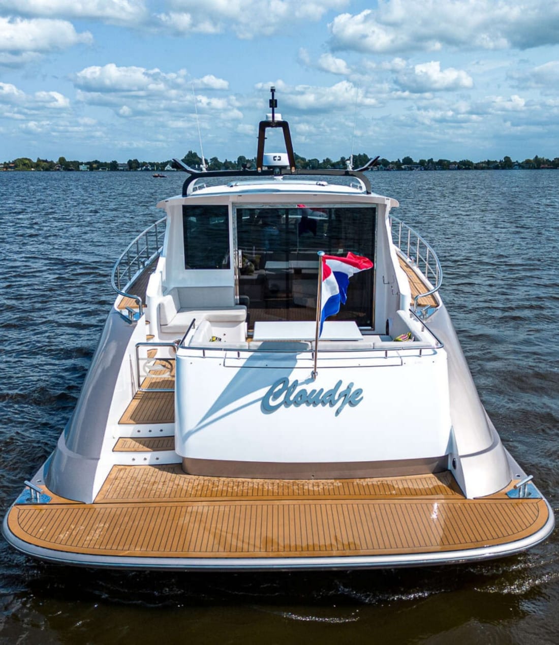Back of the luxurious Exclusive Deluxe 1700 on the water